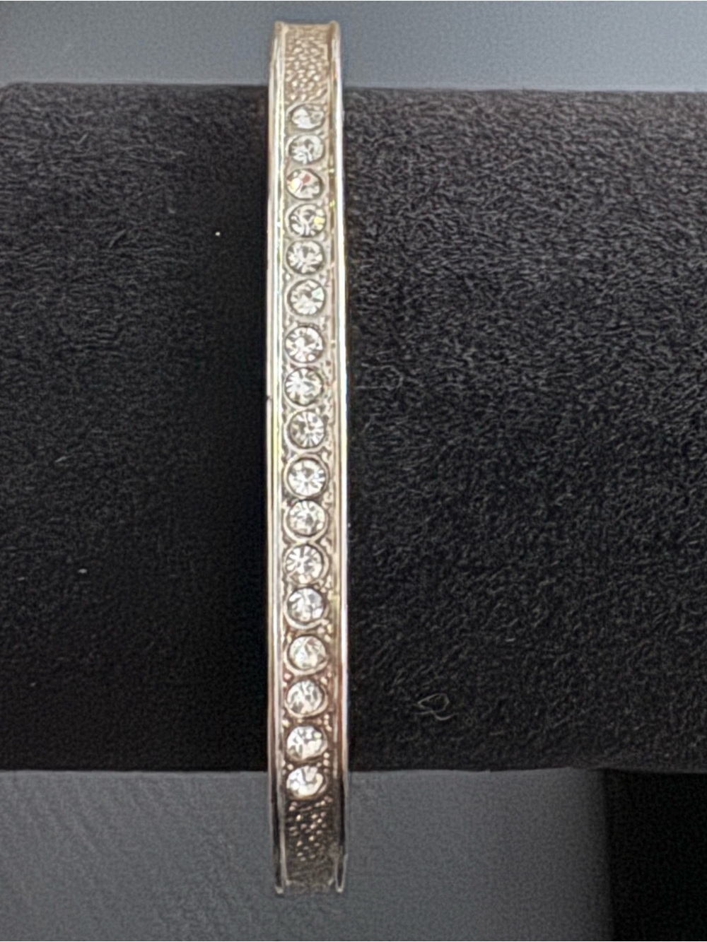 Silver-tone channel-set crystal hinged segment bracelet. Size 7
